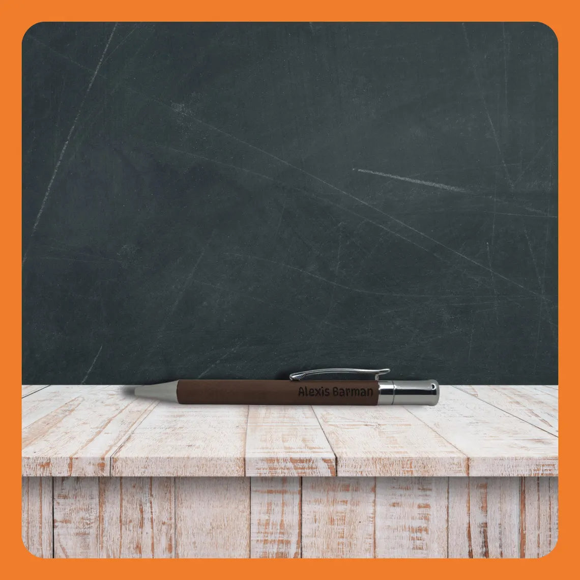A brown pen resting on a rustic wooden table in front of a chalkboard.