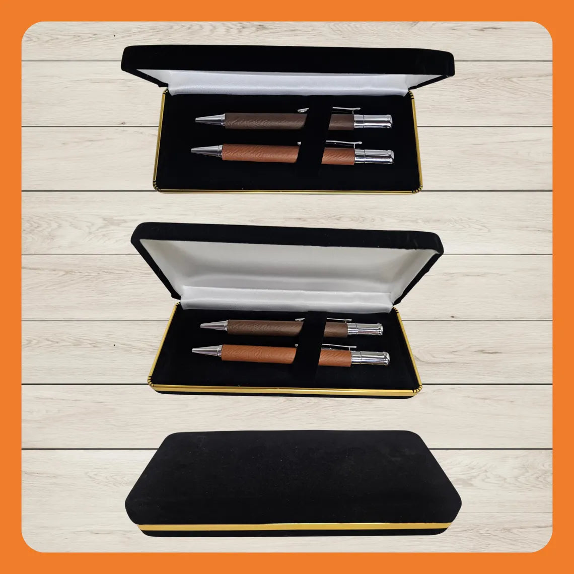Two luxury pens in a black and gold presentation box