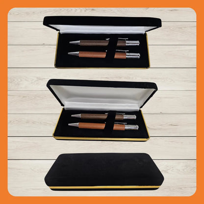 Two luxury pens in a black and gold presentation box